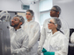 Students receive cleanroom training as participants in the Research Experiences for Undergraduates program at Boston University